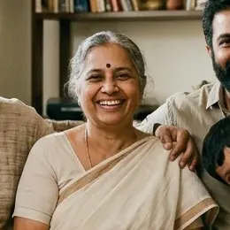 A grandmother smiling with her family