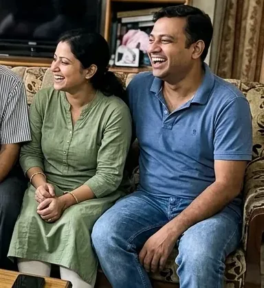 A couple smiling together at home